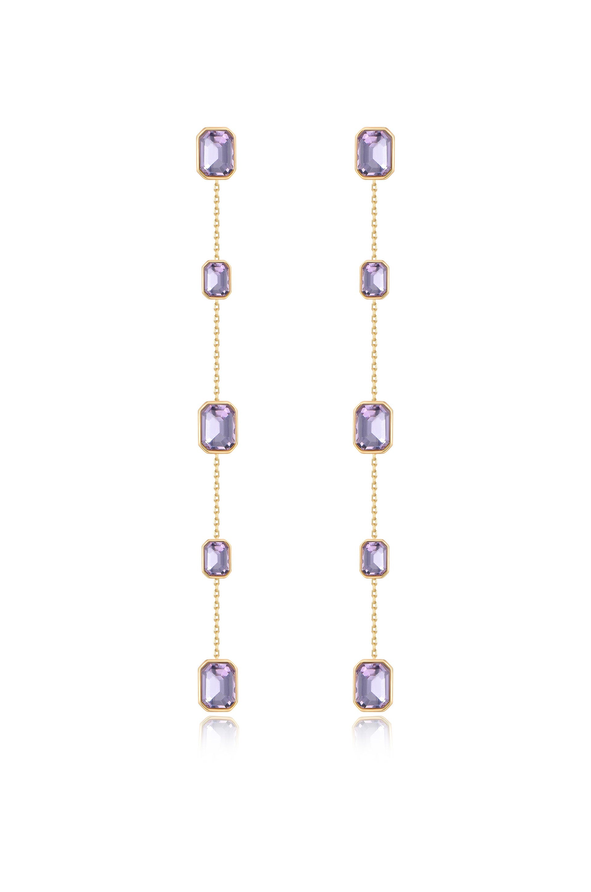 Two elegant, vertical earrings feature multiple rectangular purple gems, connected by gold chains. They hang freely, reflecting light, set against a clean, white background.