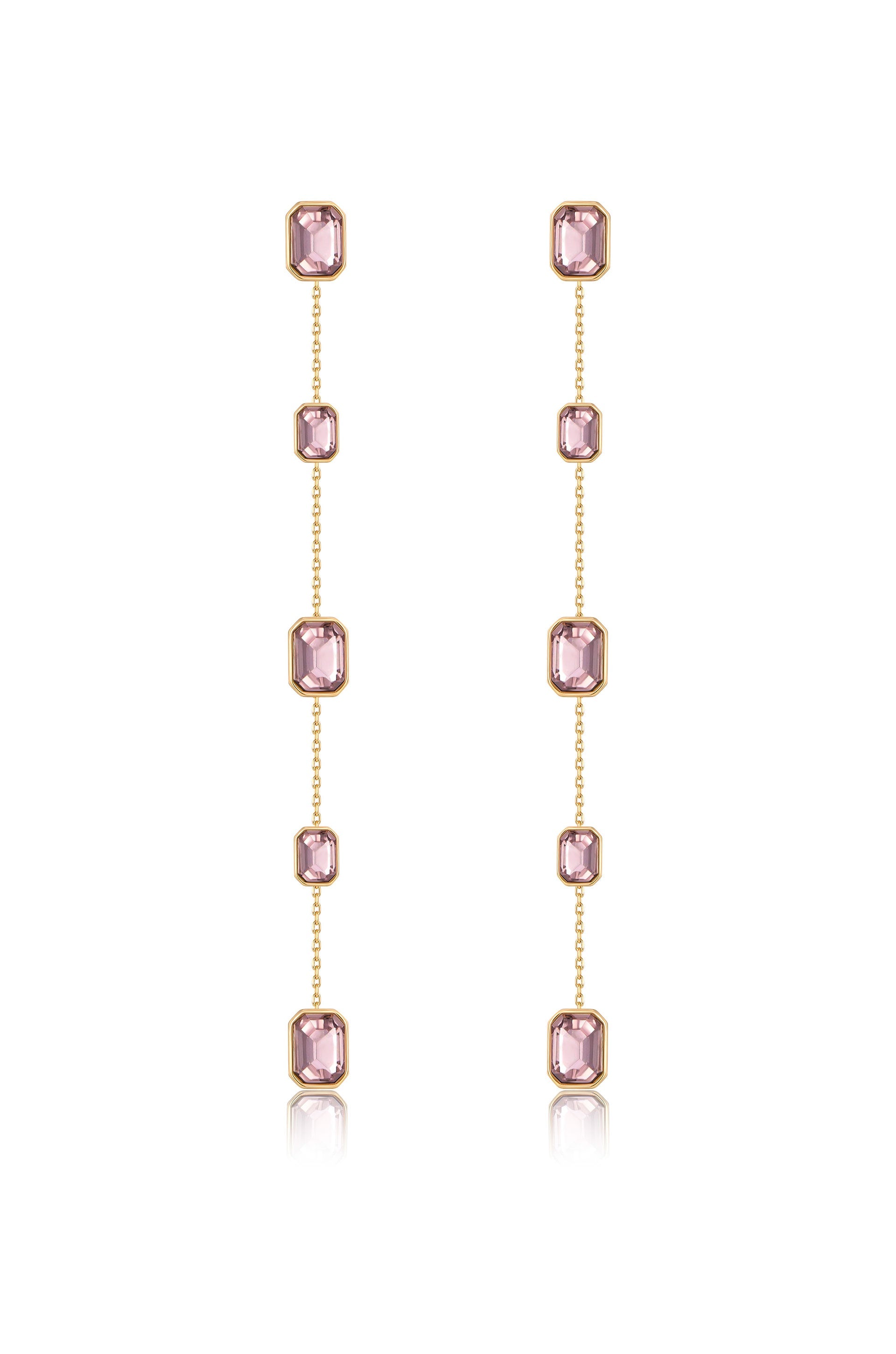 Delicate dangling earrings feature multiple pink gemstones set in gold. The arrangement showcases vertical chains, reflecting light and adding elegance in a neutral backdrop.