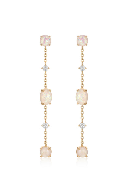 Two long, dangling earrings feature alternating opal and diamond-like stones set in gold. They hang gracefully, catching the light, suggesting elegance and sophistication.