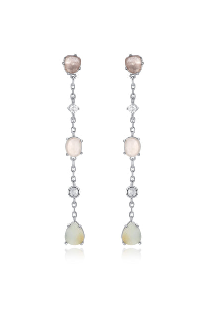 Two elegant drop earrings hang vertically, featuring alternating gemstones, including pink and cream stones, separated by small diamonds, all set in a silver chain.