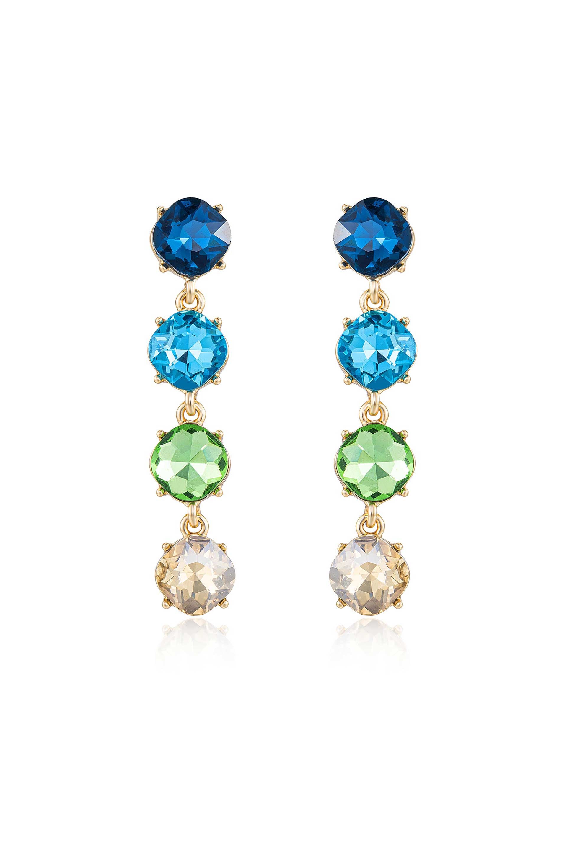 Colorful earrings feature five stacked gemstones in blue, turquoise, green, and clear, all set in gold. They hang elegantly, creating a sparkling effect against a neutral background.