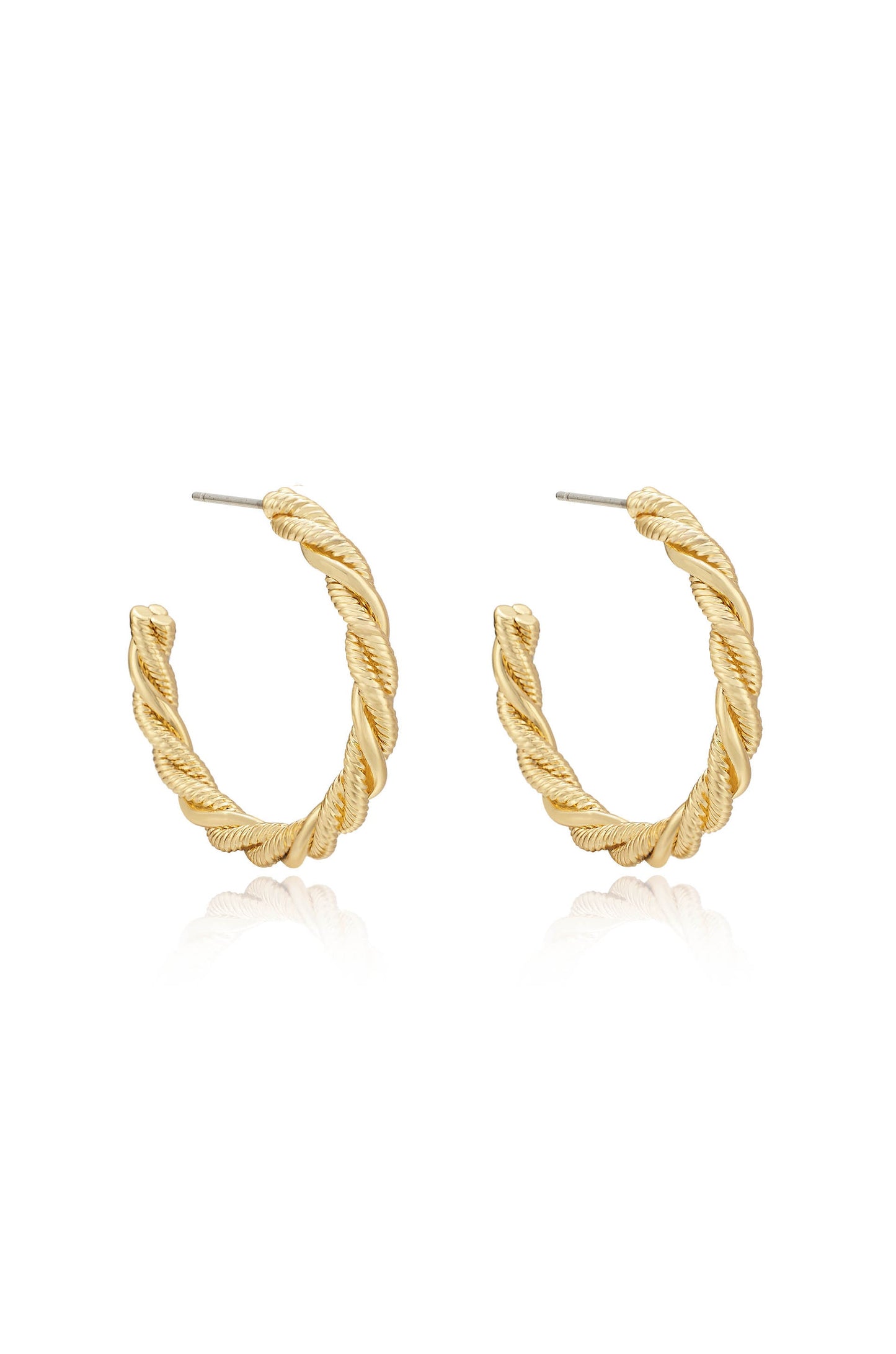 Gold hoop earrings with a twisted design are prominently displayed, reflecting light on a white background, suggesting a chic, elegant accessory suitable for various outfits.