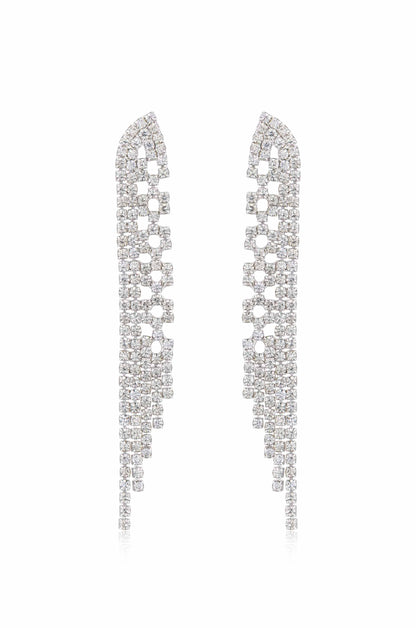 Two elegant earrings adorned with numerous sparkling gems are positioned symmetrically. Their cascading design features clustered squares and rectangles, reflecting light against a clean, white background.