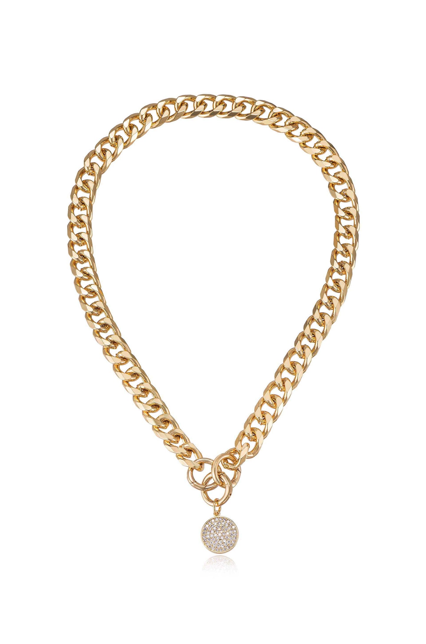 A gold chain necklace features thick, interlocking links with a circular charm adorned with small sparkling stones, suspended centrally. The background is simple, emphasizing the jewelryâ€™s shine and design.