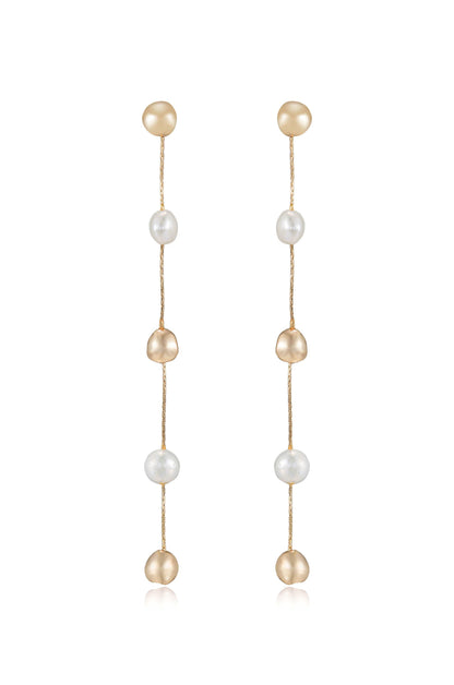 Dangling earrings made of alternating pearls and gold beads, showcasing a visually appealing mix of textures and shapes, likely designed for elegant occasions. The background is plain, emphasizing the earrings.