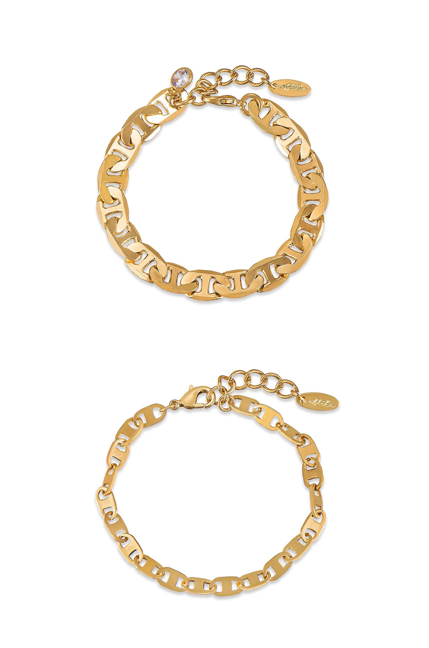 A pair of gold chain bracelets is displayed with intricate linked designs and a decorative clasp. Each features a small charm, resting on a plain white background.