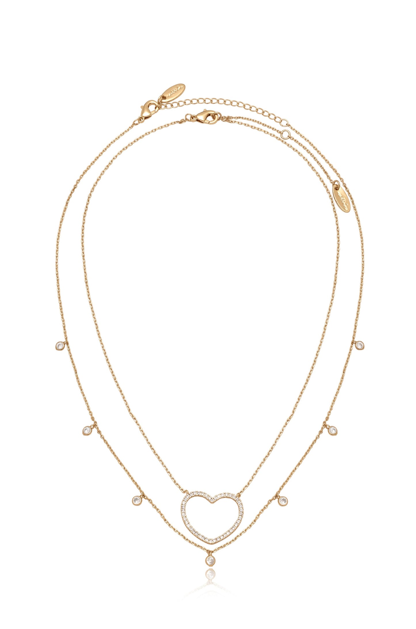 A gold layered necklace features a heart-shaped pendant embellished with sparkling gems. Delicate chains create a graceful design, set against a plain white background, emphasizing its elegance.