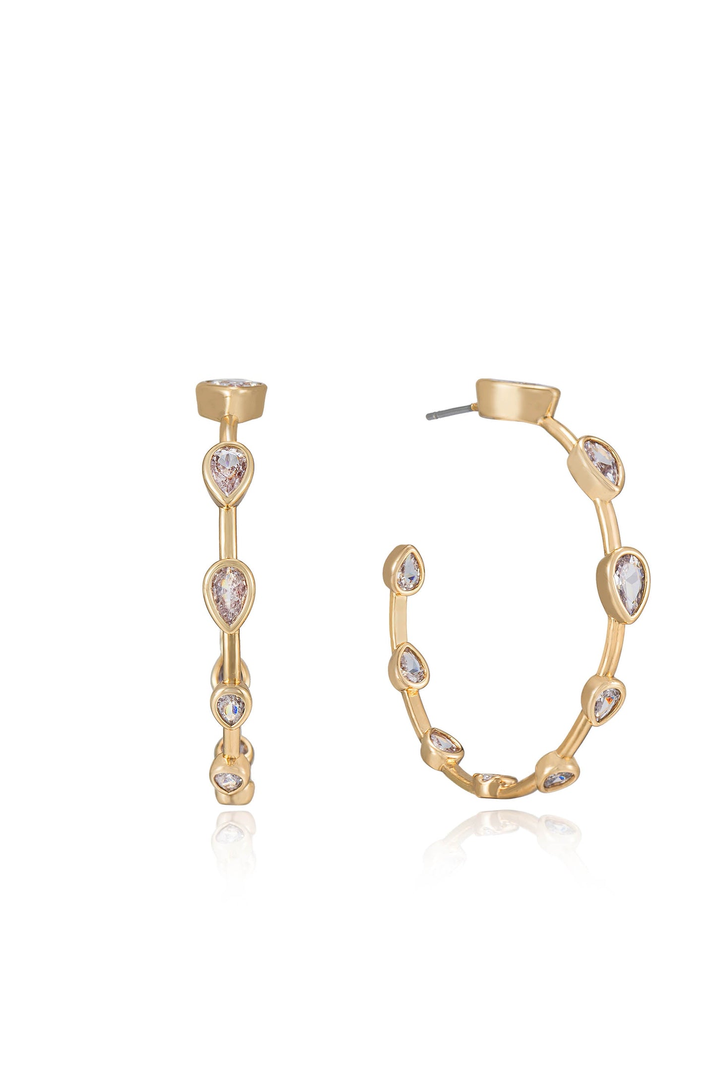 Two gold earrings are displayed, one a linear design with multiple gemstones and the other a rounded hoop style, each adorned with sparkling decorative stones reflecting light against a neutral background.