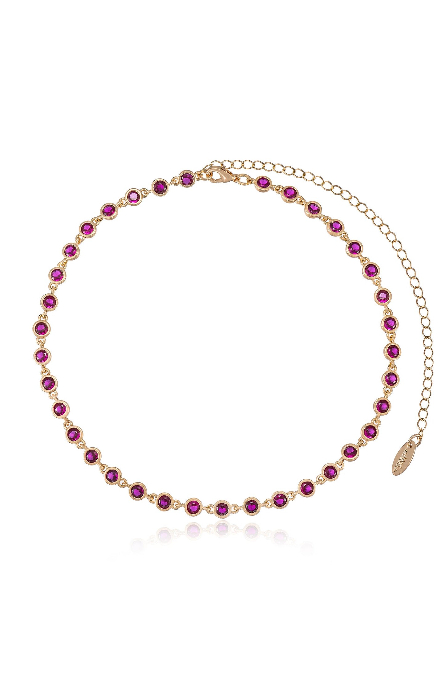 A delicate gold necklace features a series of round, deep pink gemstones set in a uniform pattern. It includes a clasp with an adjustable chain for sizing.