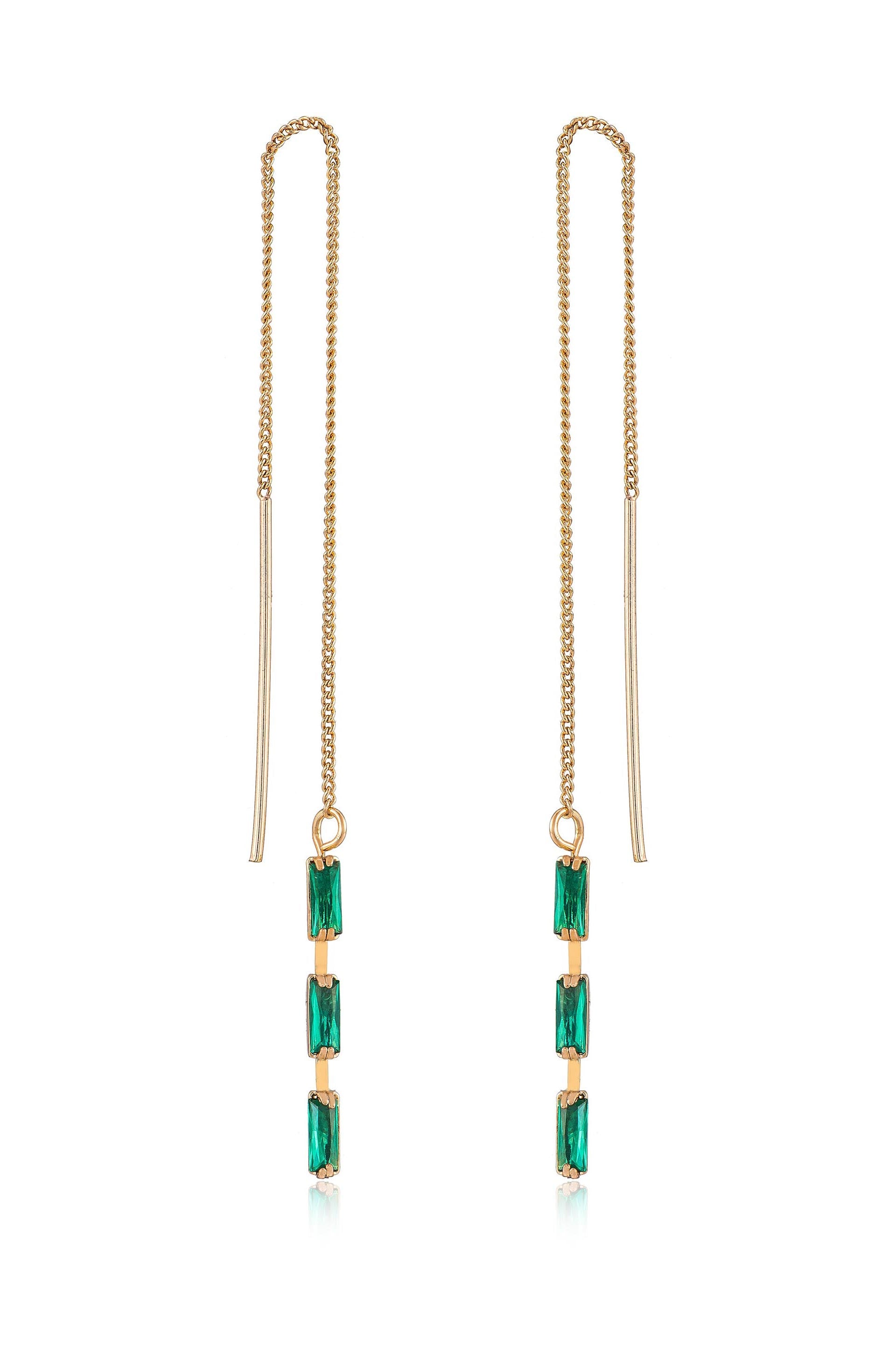 Gold chain earrings feature three vertical, rectangular green gemstones suspended from a long chain. They hang elegantly, capturing light and adding a vibrant touch to any outfit.