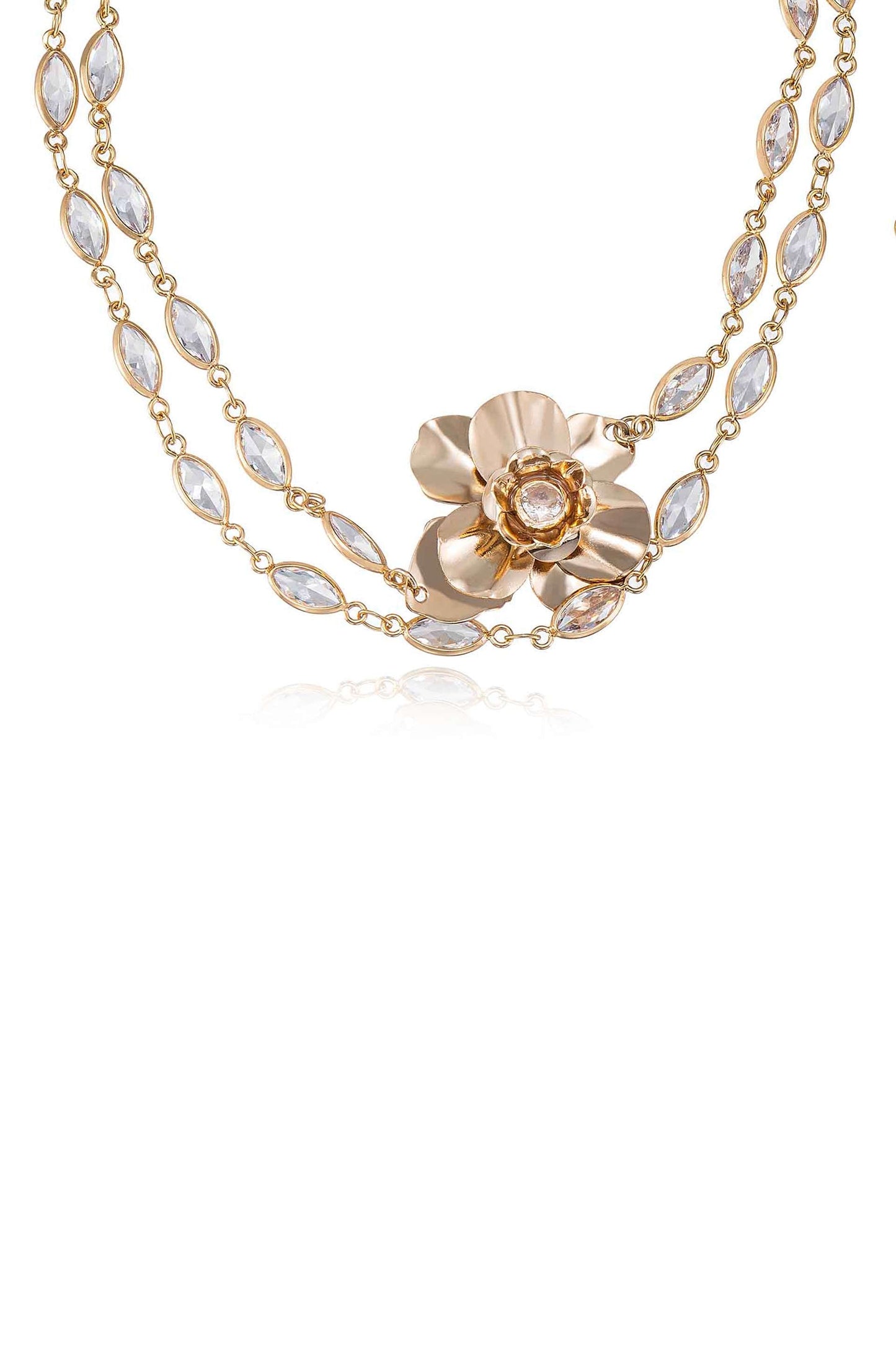 A delicate gold necklace features a floral design with a central gemstone. The necklace is adorned with alternating gold and clear gemstone links, set against a white background.