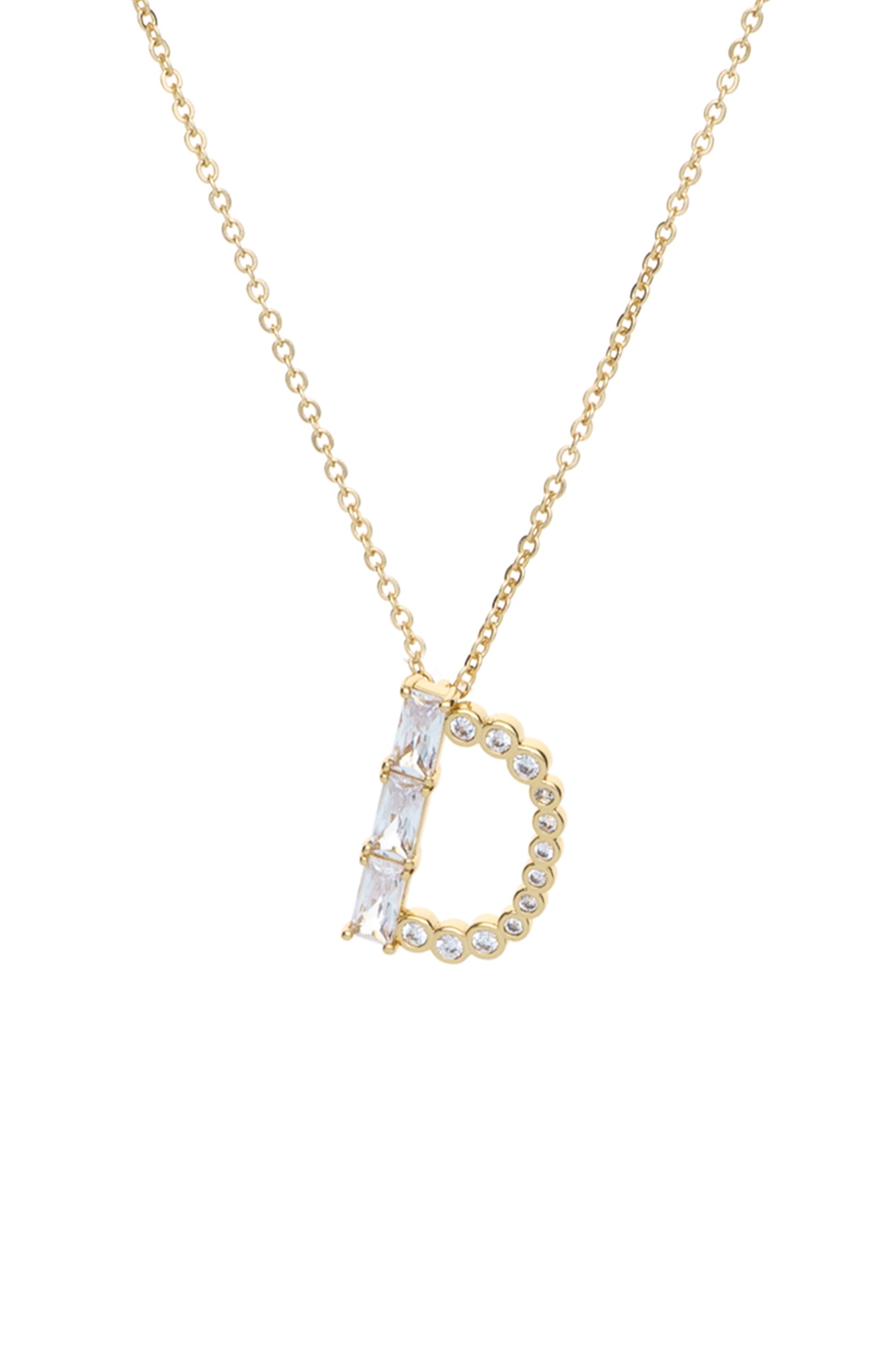 A gold necklace features a "D" pendant, adorned with clear, sparkling gemstones. The pendant hangs from a delicate chain, illuminated against a white background.