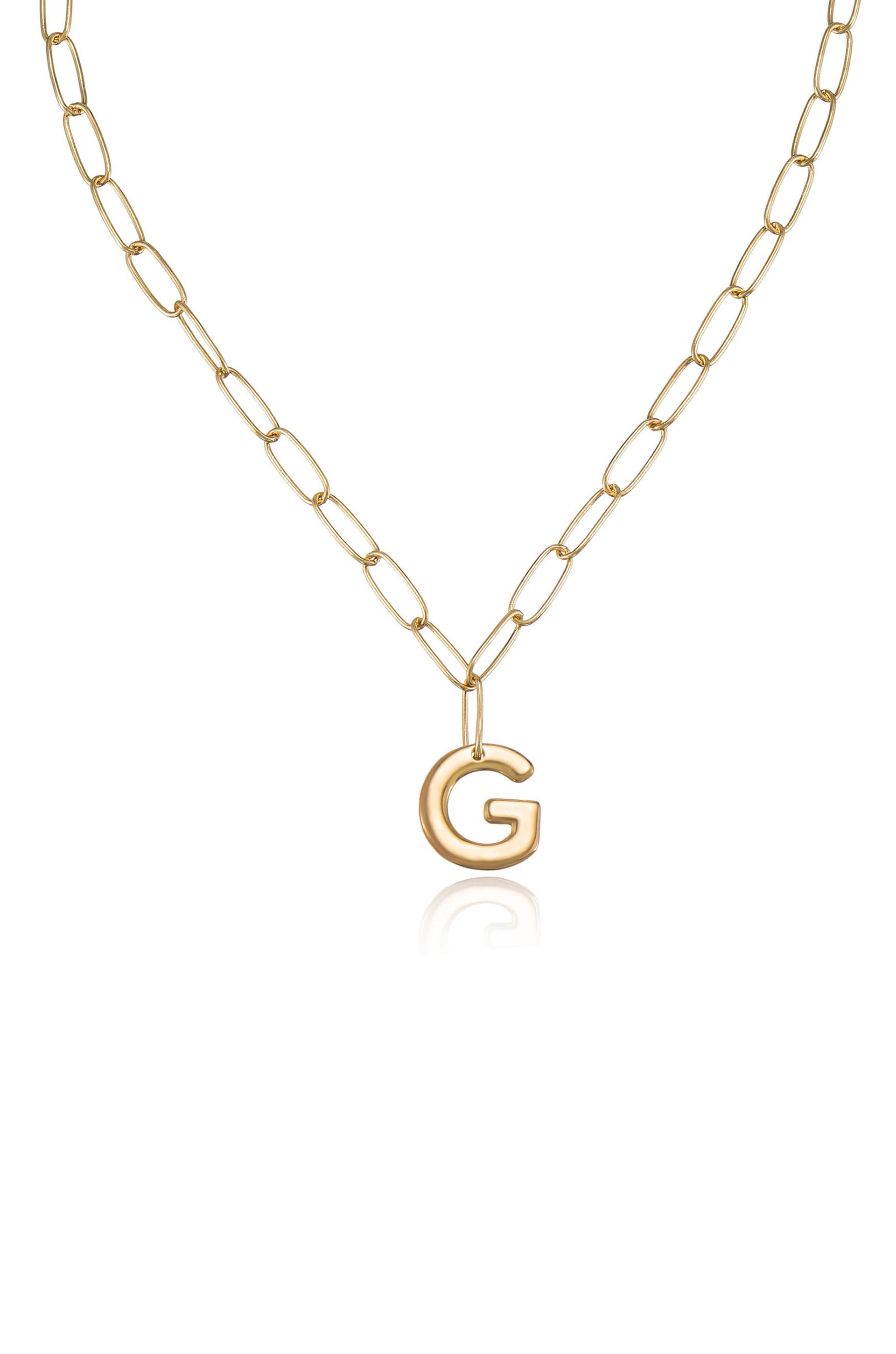 A gold chain necklace features a large, shiny letter "G" pendant. The metal reflects light, emphasizing its glossy finish against a plain white background.