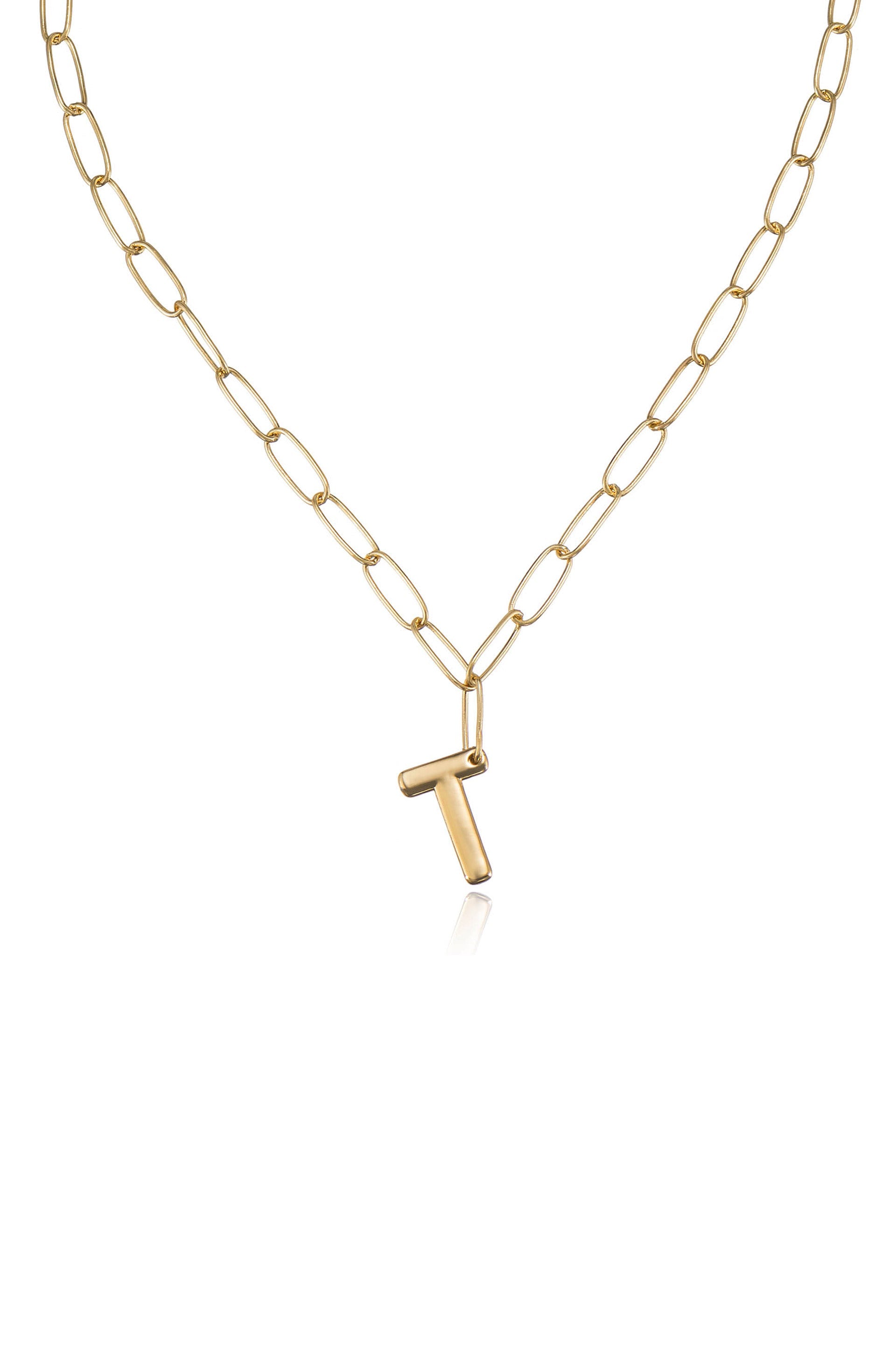 A gold chain necklace features elongated oval links holding a gold letter 'T' pendant, reflecting light against a plain white background.