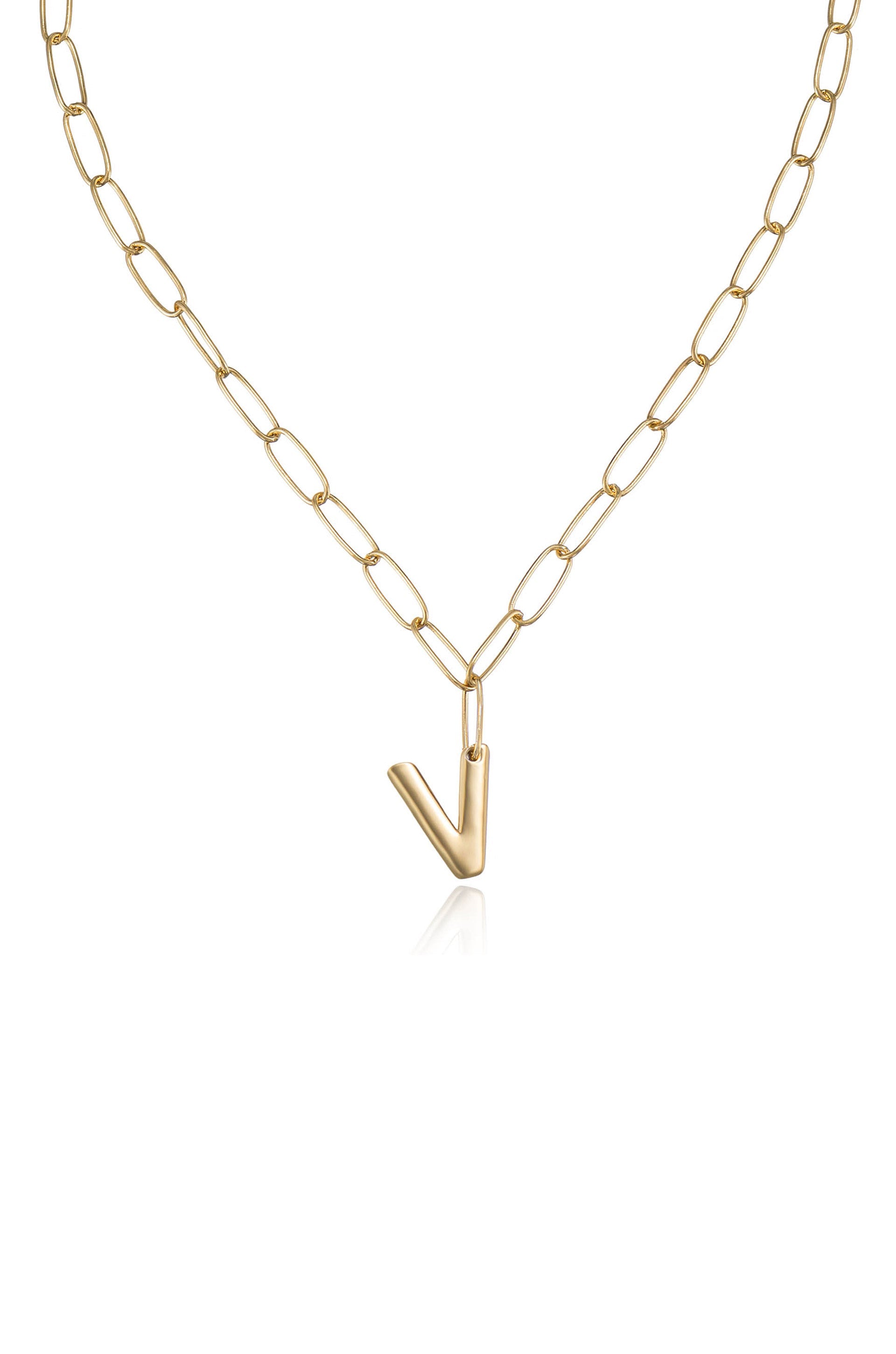 A gold chain necklace features oval links and a prominent 'V'-shaped pendant, hanging centrally. The necklace's sheen reflects light, set against a plain, neutral background.