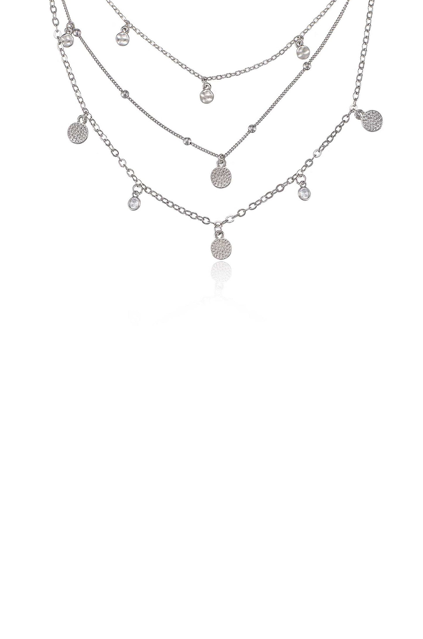 A silver necklace with multiple layered chains features various small pendants, including textured circles and clear beads, displayed against a white background.