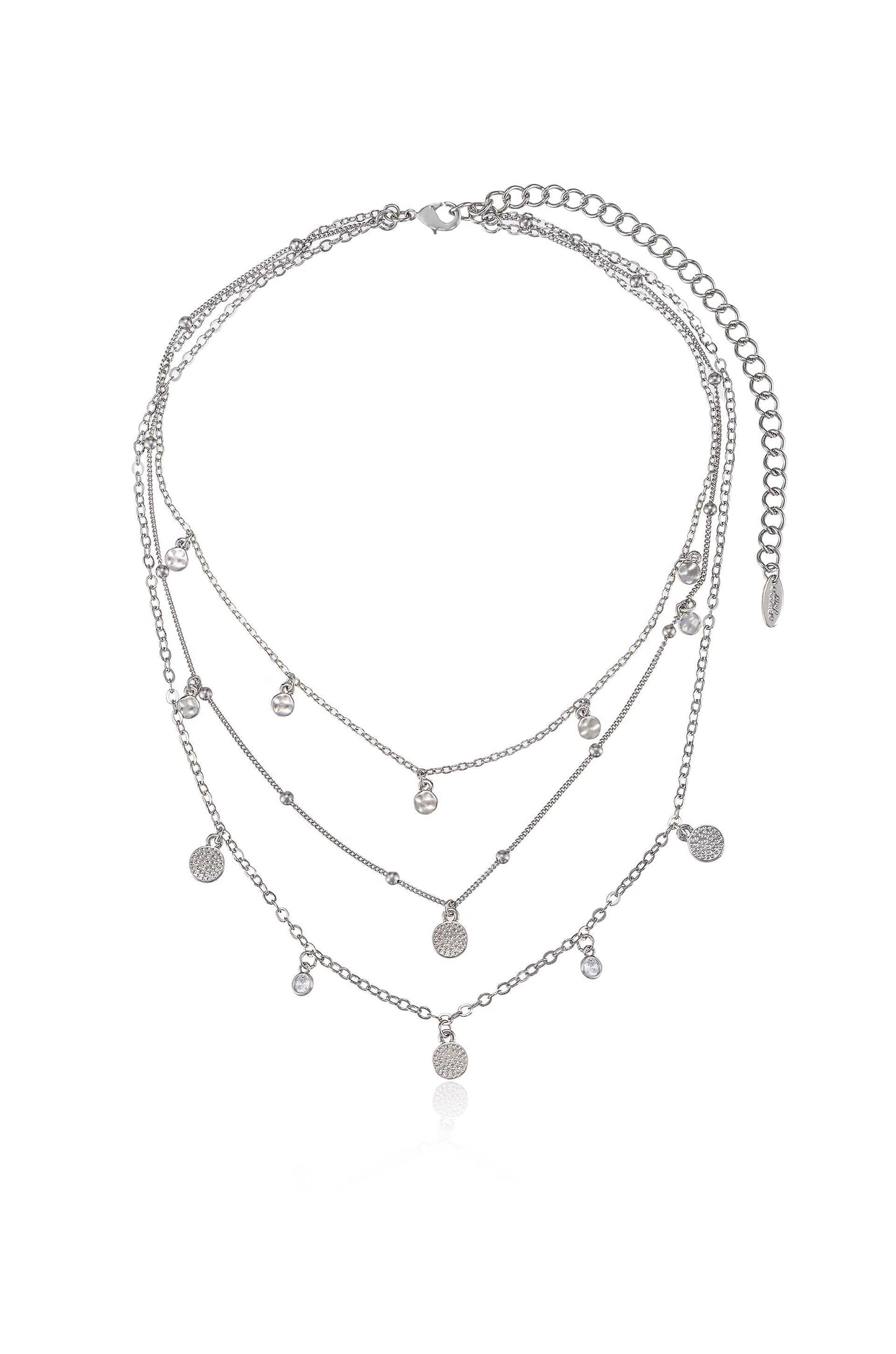 A multi-layered silver necklace hangs gracefully, featuring various small pendants and beads. Its elegant design suggests it is suitable for formal or casual occasions, catching light attractively.