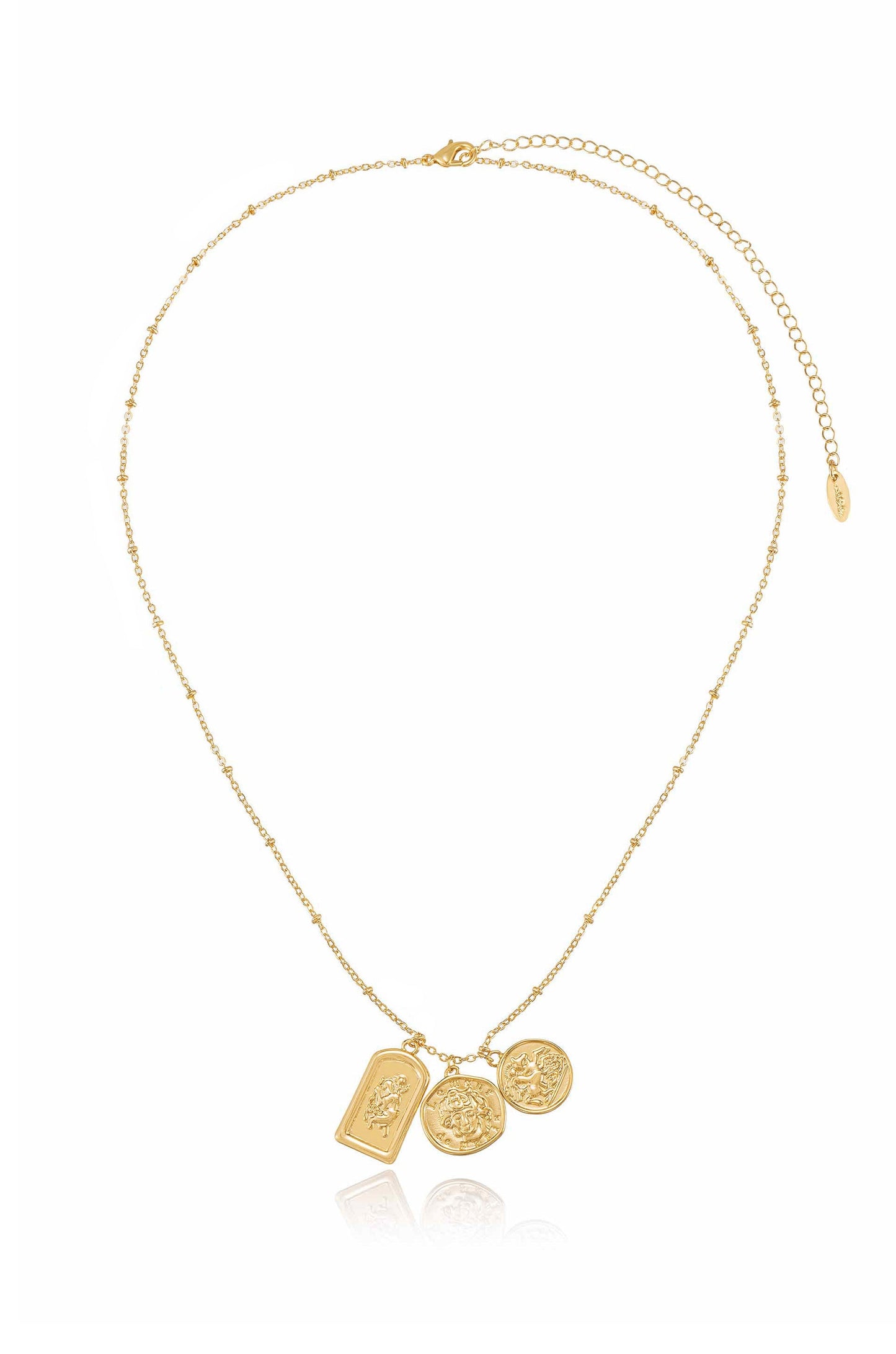 A delicate gold necklace features a chain with three pendants: two round coins and one rectangular bar. The jewelry is set against a plain white background, highlighting its shine.