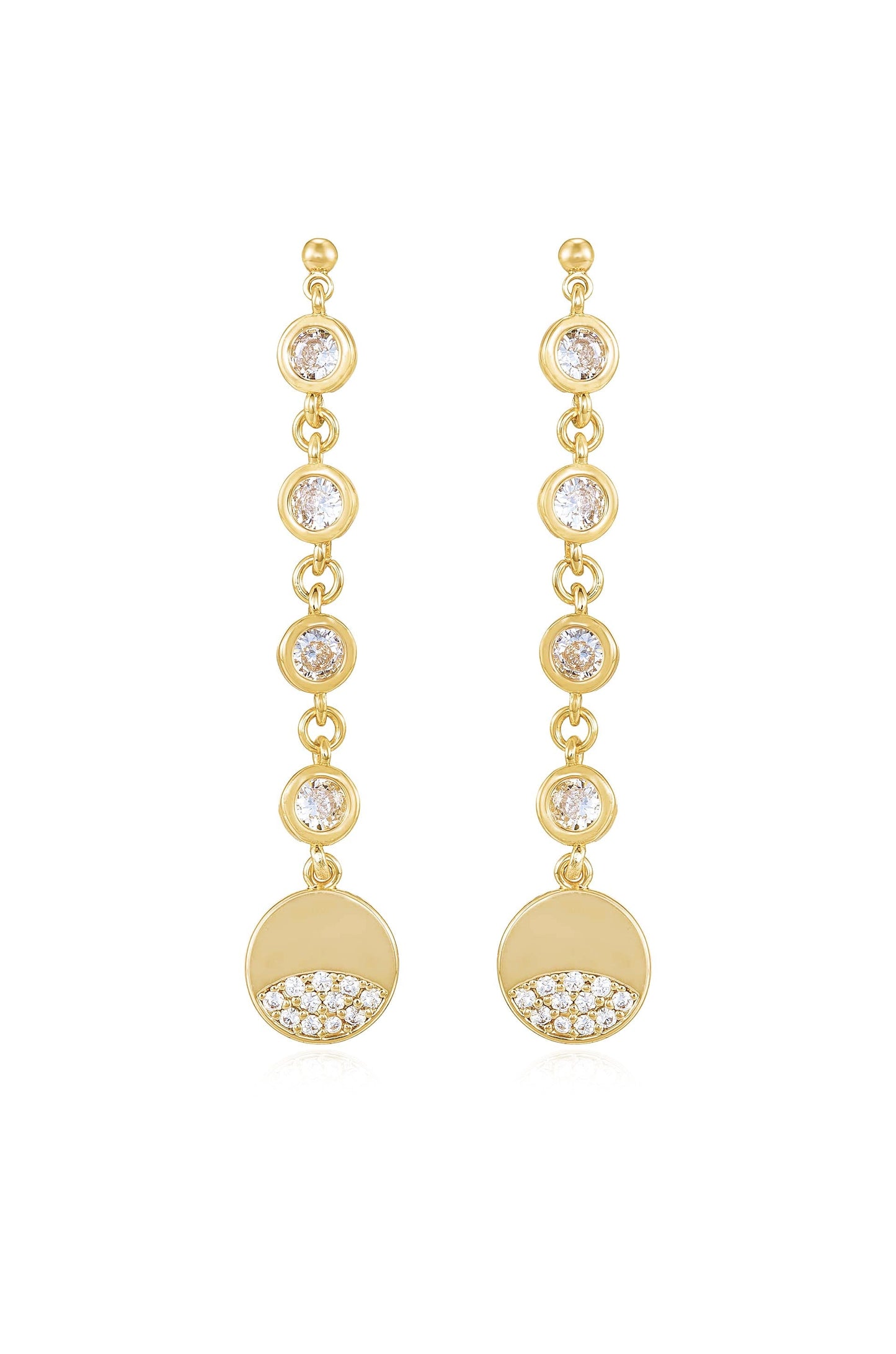 Gold earrings feature dangling elements with circular designs. Each earring has several sparkling gems arranged along the chain, culminating in a round disc adorned with smaller stones at the bottom.