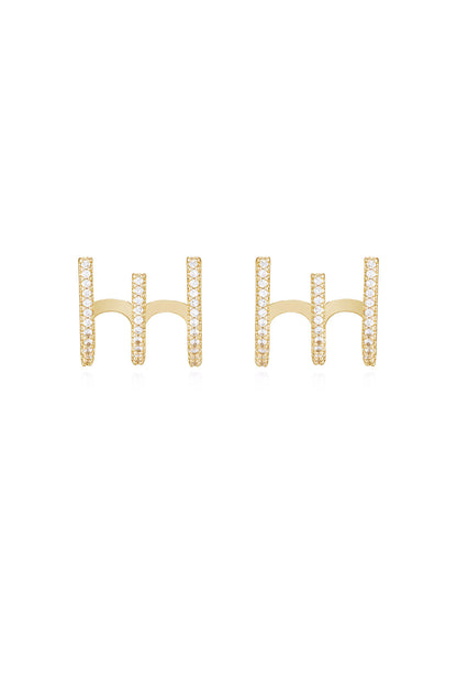 Gold earrings featuring vertical bars encrusted with clear rhinestones. The earrings are presented on a plain white background, emphasizing their sparkle and modern design.