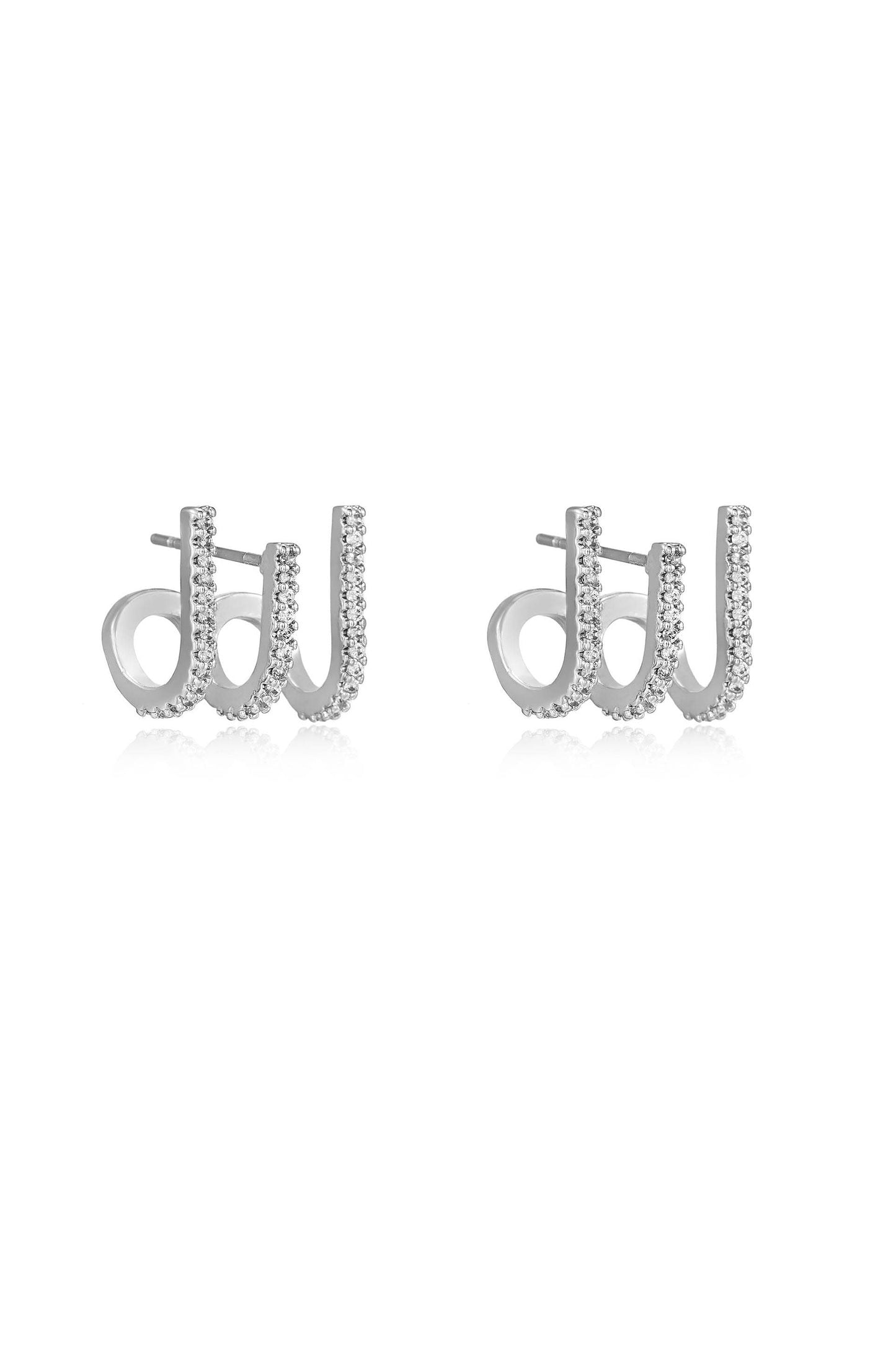 Silver earrings shaped like the letters "d" and "w," adorned with small sparkling stones. They are displayed against a plain white background.