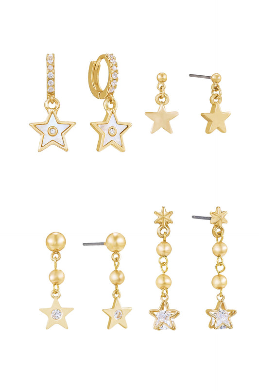 A collection of six pairs of gold star-themed earrings exhibits various designs, including hoops with stars, stud earrings, and dangling styles, displayed against a plain white background.