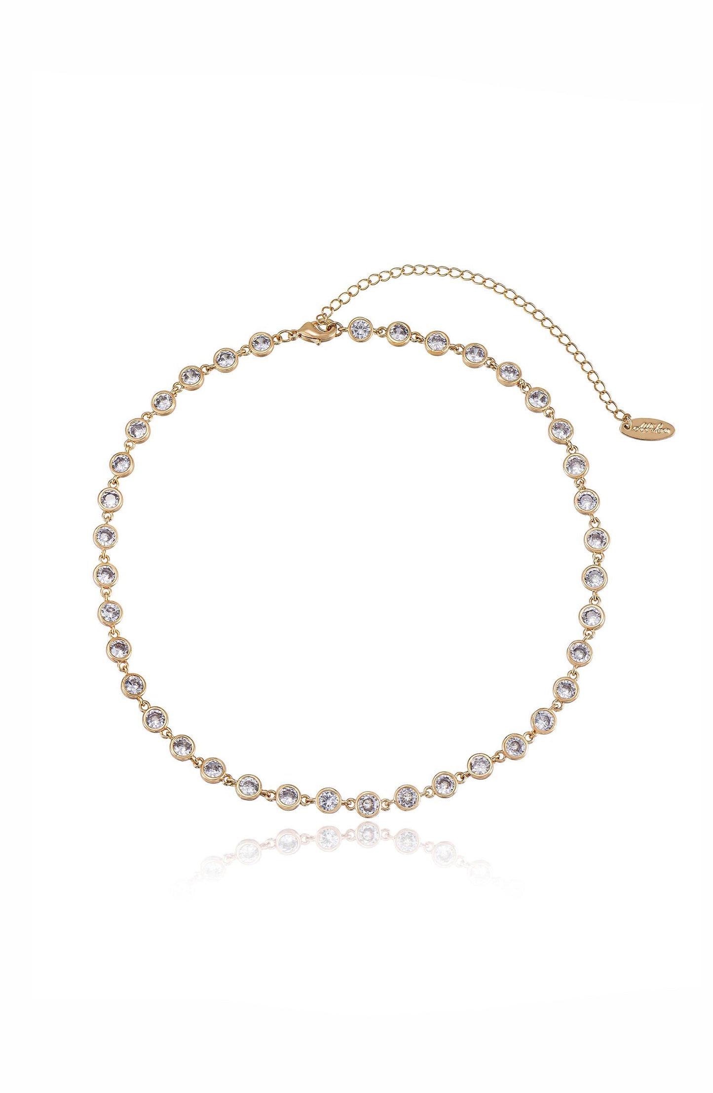 A delicate gold necklace features a series of evenly spaced, shimmering circular gemstones, highlighting its elegant design against a clean, white background. A clasp and chain extension are visible.