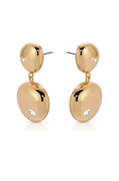 Gold earrings feature two polished, dome-shaped pieces connected by a small chain, with a sparkling gemstone on each. The earrings are displayed against a plain white background.