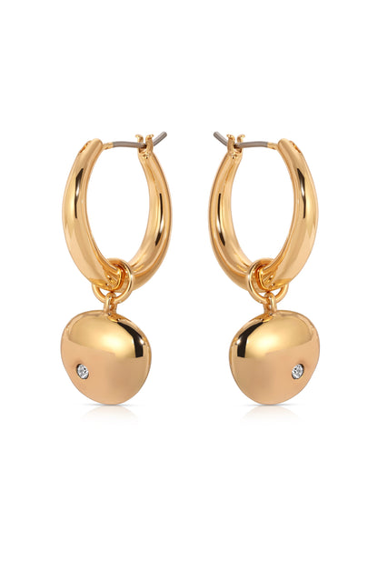 Gold hoop earrings with a shiny, rounded charm dangling from each. The charms feature a small diamond accent, reflecting light against a simple white backdrop, highlighting their elegant design.