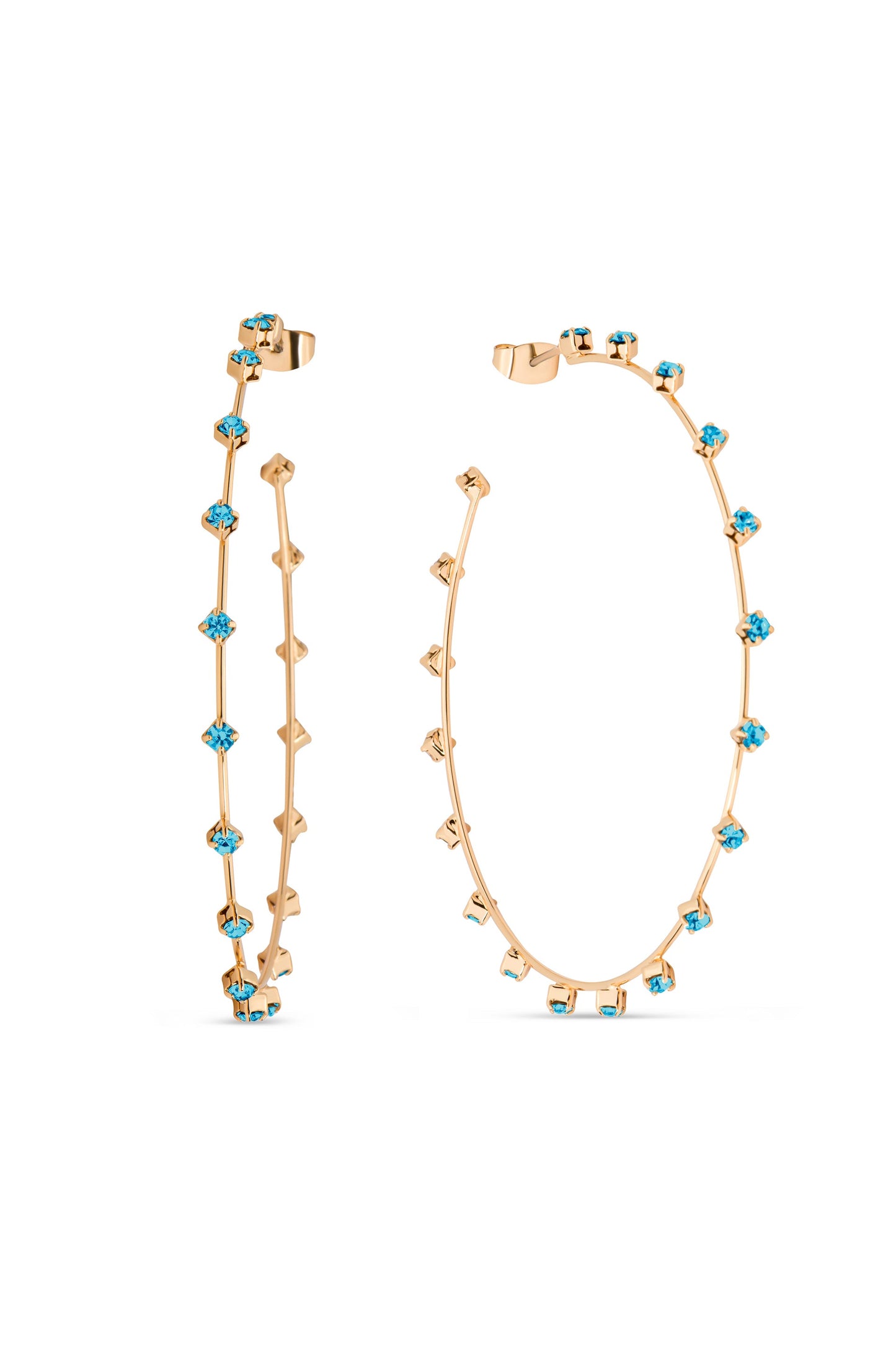 Two gold hoop earrings stand side by side, embellished with blue gemstones. Their slender design features alternating shapes and colors, showcasing elegance against a plain white background.