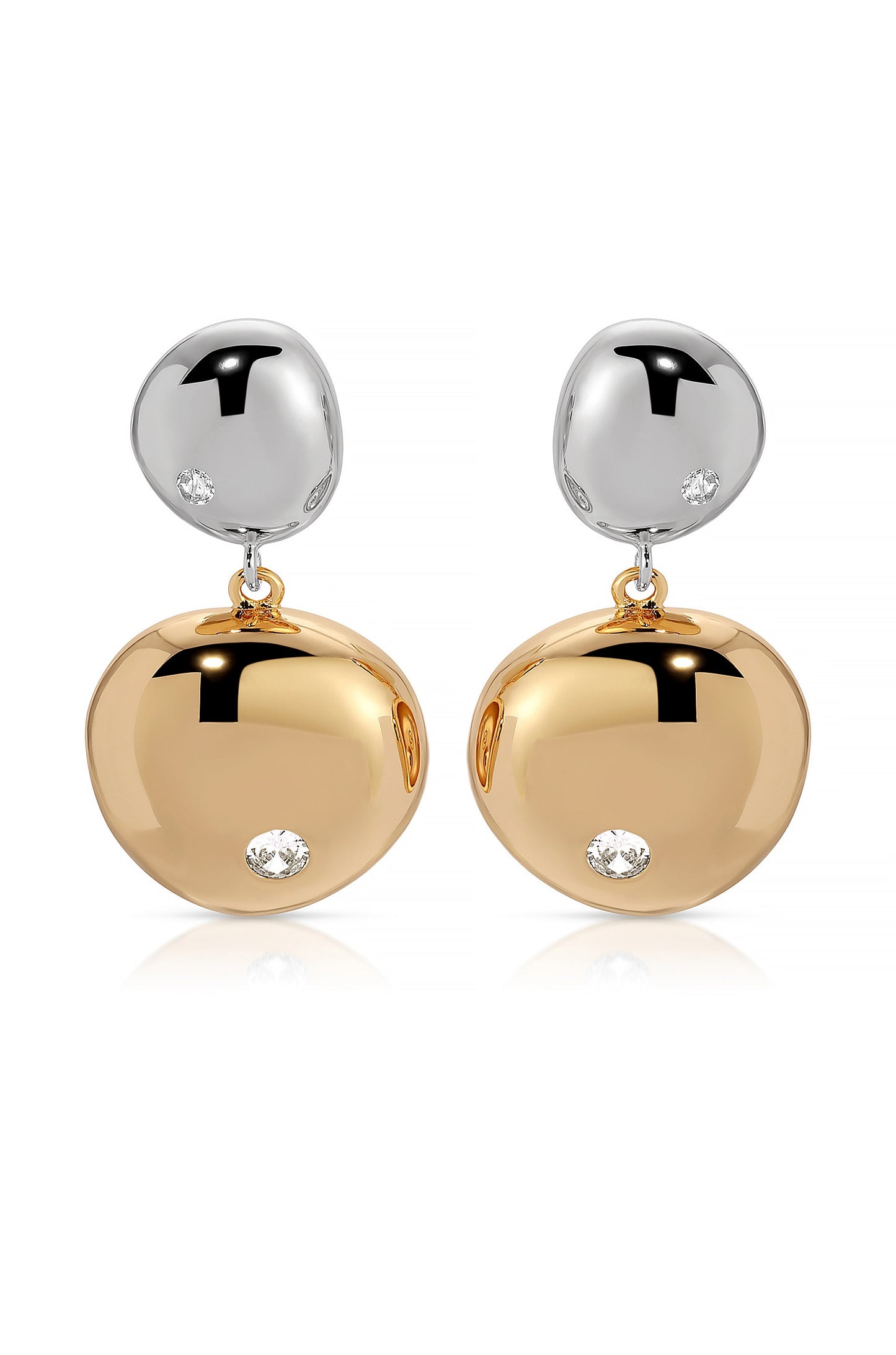 Earrings hang elegantly, featuring a shiny silver top and a larger, polished golden drop below, each adorned with a small diamond. They are displayed against a white background.