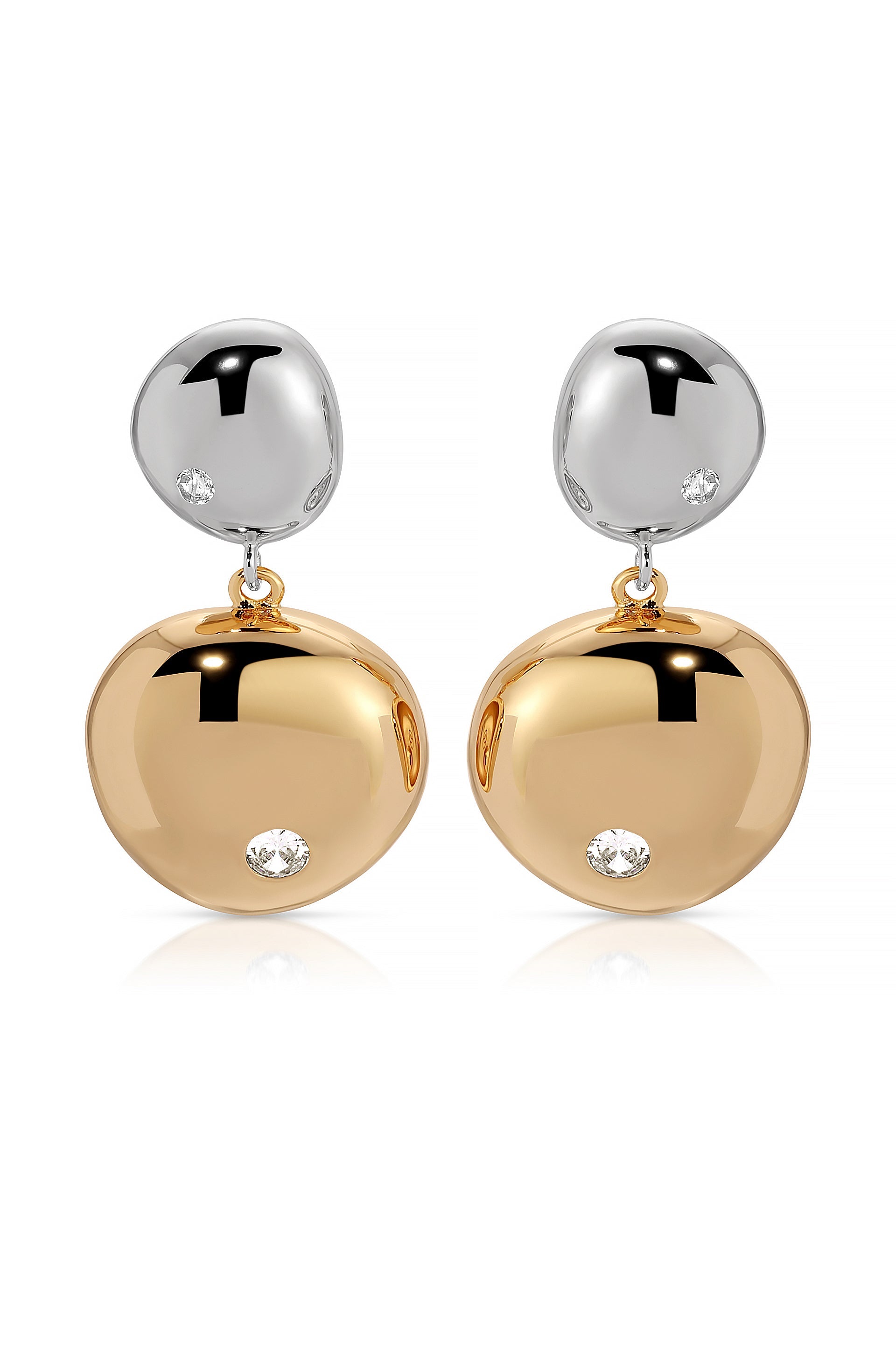 Earrings hang elegantly, featuring a shiny silver top and a larger, polished golden drop below, each adorned with a small diamond. They are displayed against a white background.