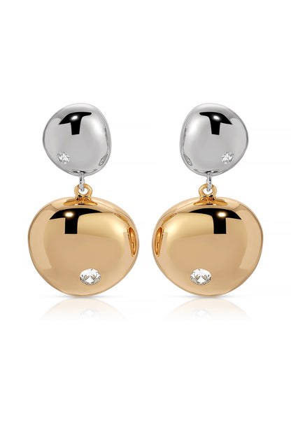 Earrings hang elegantly, featuring a shiny silver top and a larger, polished golden drop below, each adorned with a small diamond. They are displayed against a white background.