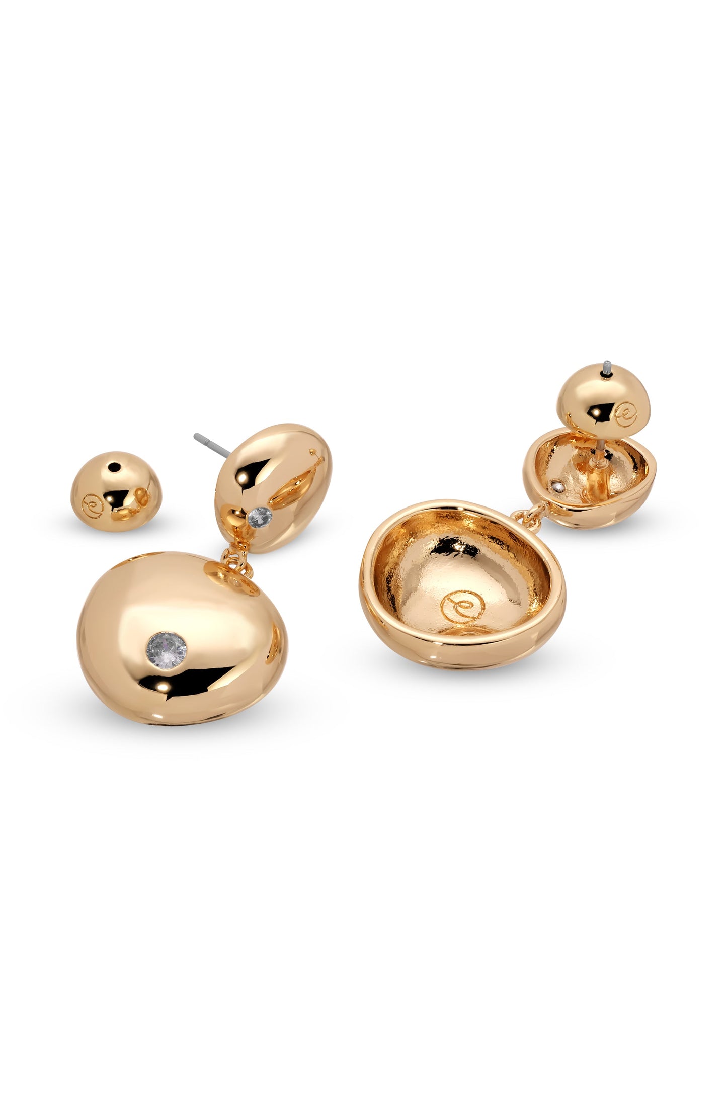 Golden earrings are displayed, featuring rounded designs with embedded gemstones. One earring is a stud, while the other has a dangling element, set against a white background.