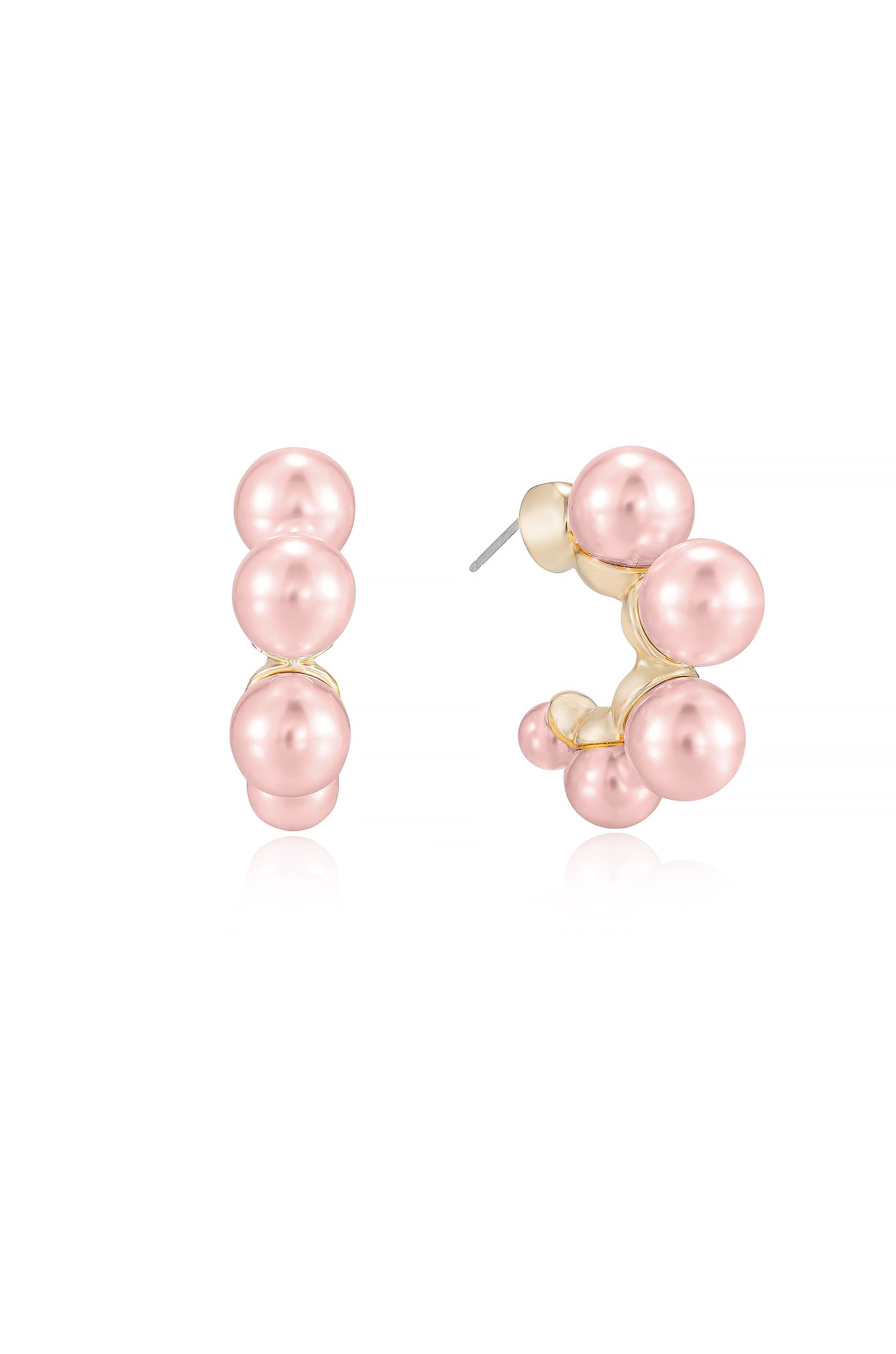 A pair of pink pearl earrings showcases a cluster design, with several graduated-sized pearls mounted on a gold base. They glisten against a plain white background.