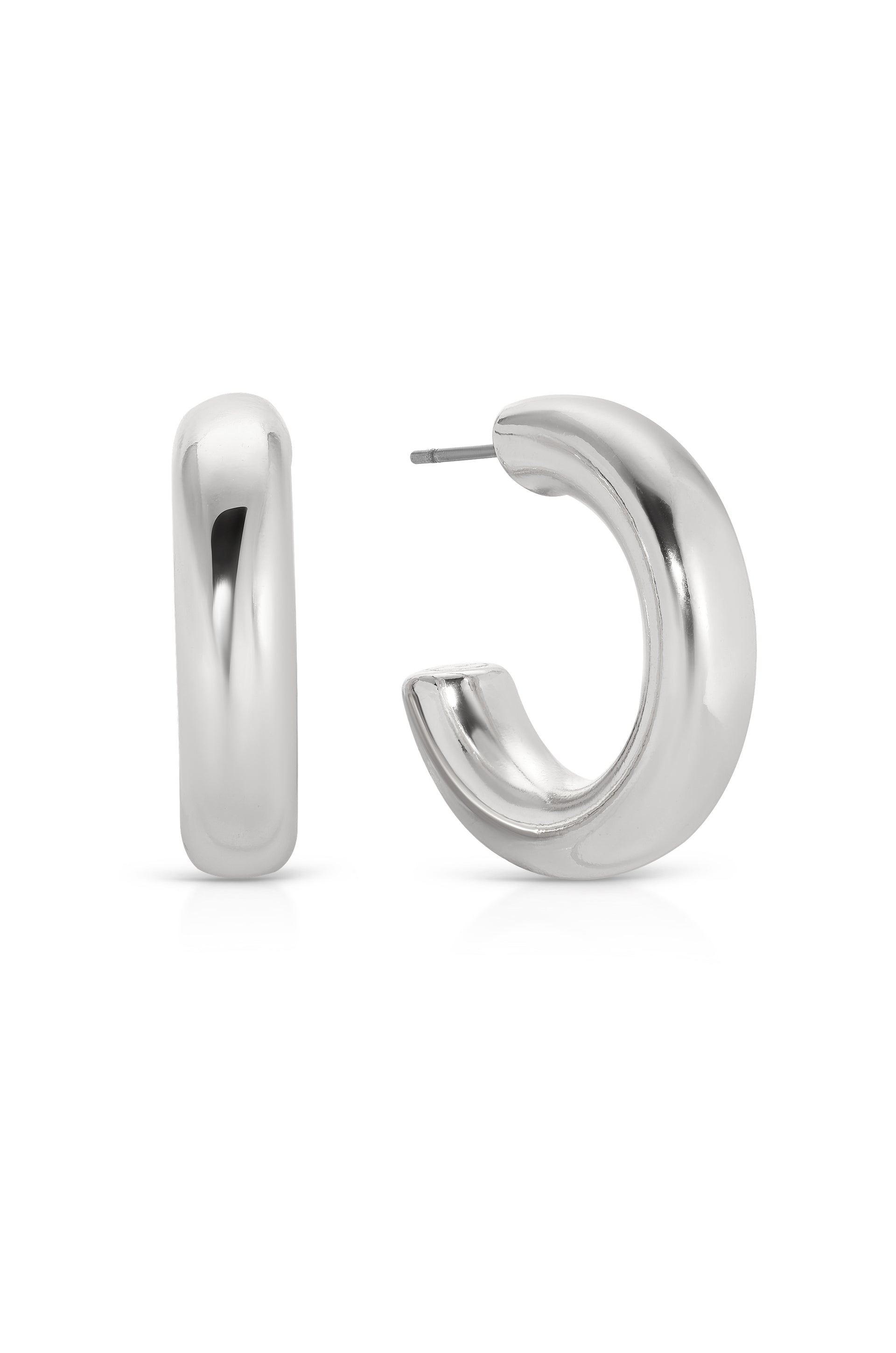 A pair of shiny silver hoop earrings is displayed, one facing front and the other side-on. They have a smooth, rounded design with a thin post for fastening.