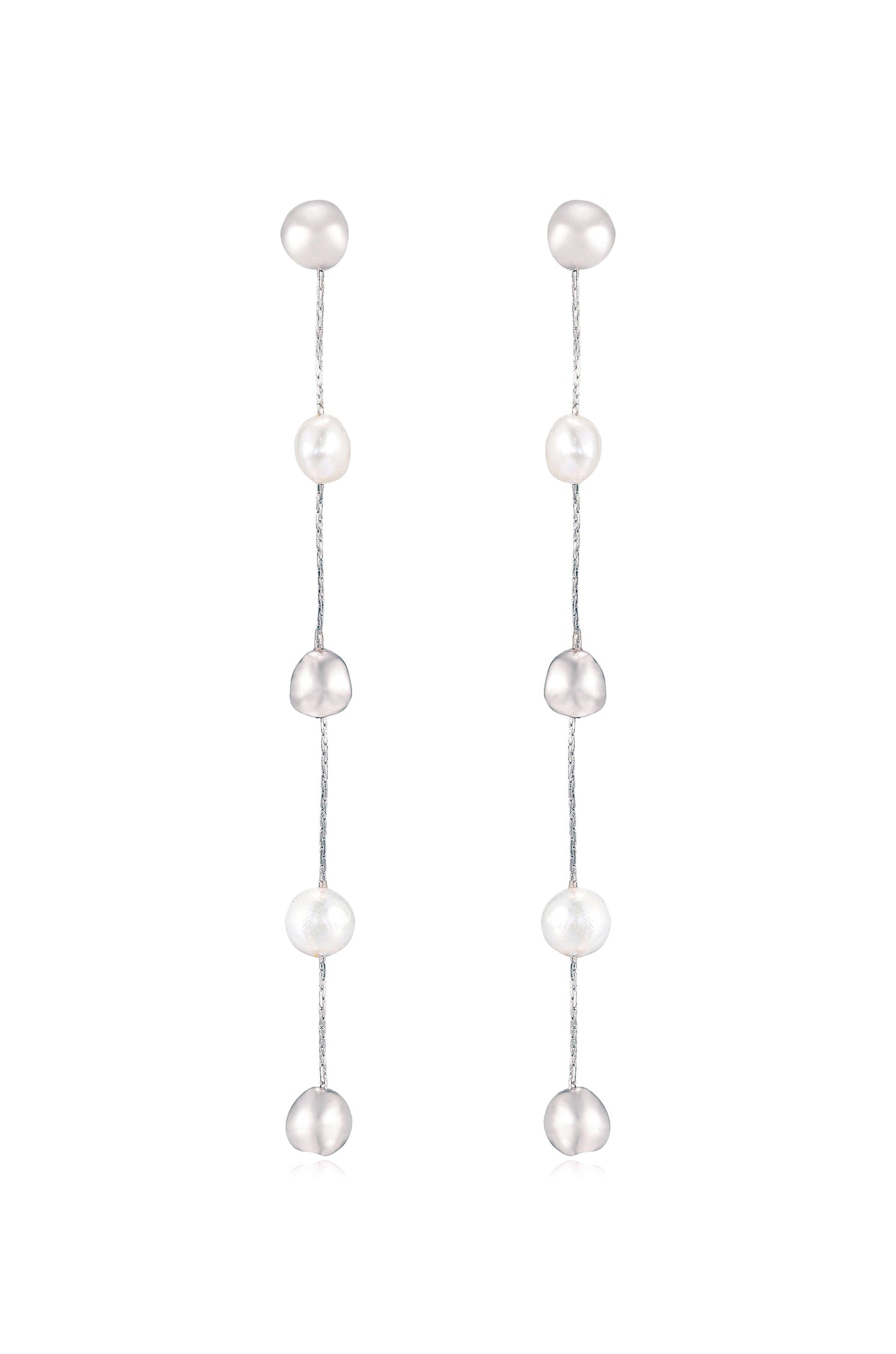 Earrings made of pearls hang vertically on thin silver chains. The design features alternating round, shiny pearls in varying shades, creating an elegant appearance suitable for formal occasions.