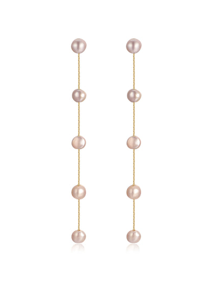 Two long, dangling earrings feature a series of round, pink pearls connected by thin gold chains, designed to enhance elegance and complement formal or casual attire.