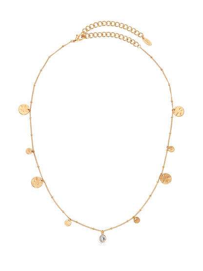 A delicate gold necklace features various small, circular pendants and a central sparkling stone. The chain has a lobster clasp and an adjustable length to suit different neck sizes.