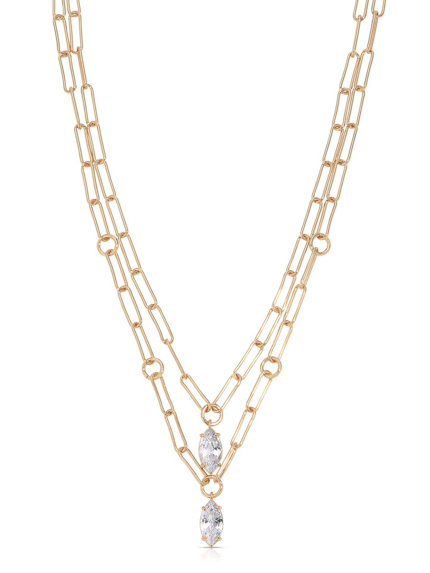 A gold chain necklace features two layered strands with elongated links. At the center, two marquise-cut crystals dangle, enhancing the jewelry's elegance against a neutral background.