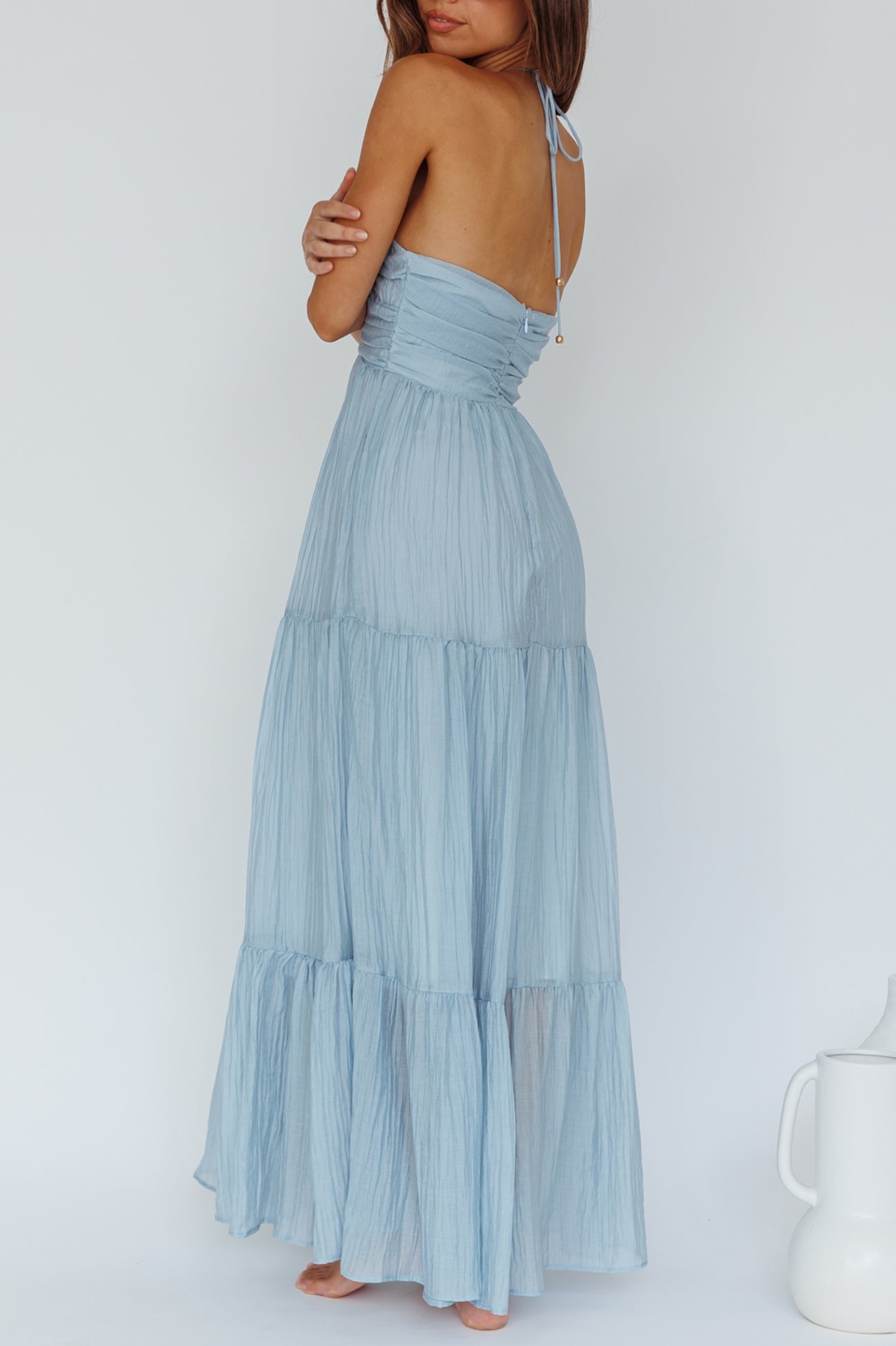 Light Blue crinkle fabric maxi dress with a wired v neck line and thin halter criss cross straps, back with hidden zipper 