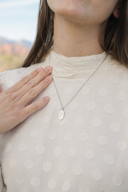 Bow Pendant Necklace in Silver